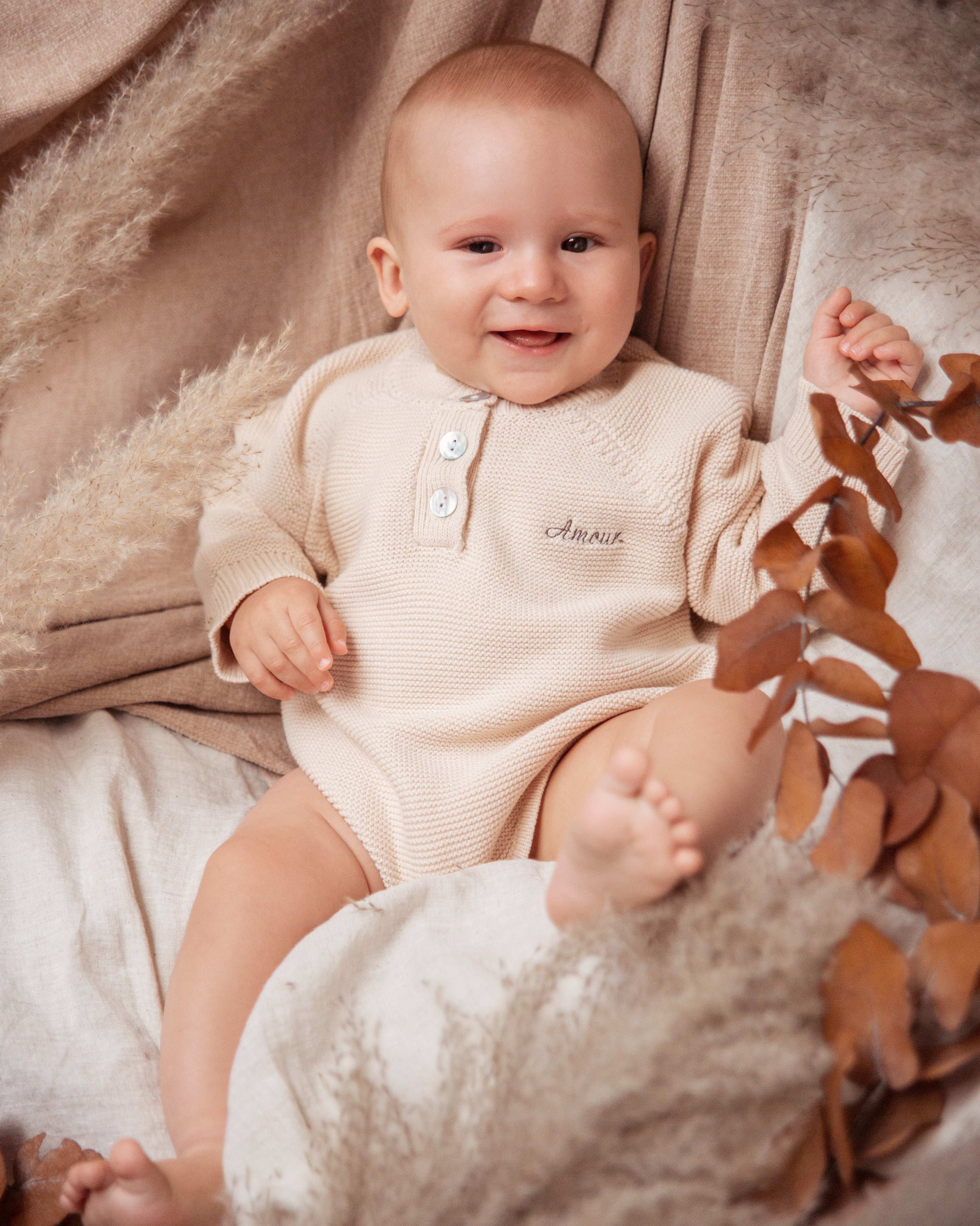 Beige knitted romper